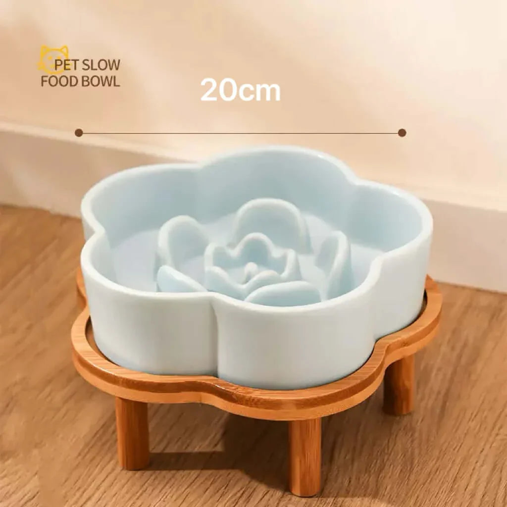 Petroom light blue ceramic flower-shaped slow feeder bowl on a wooden stand