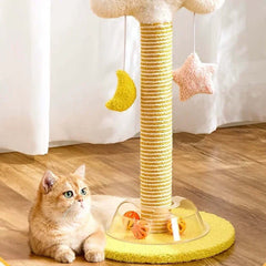 Cute ginger cat beside yellow sisal scratching post with moon and star toys, ideal for indoor cats.