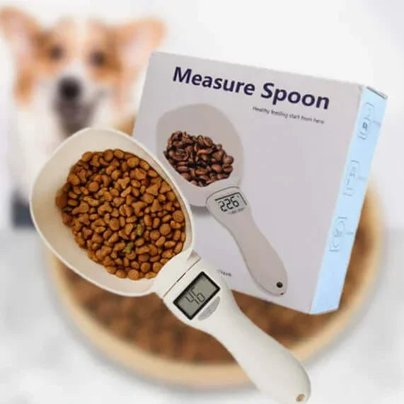 Digital measure spoon for dog food with LCD display, shown with kibble and packaging