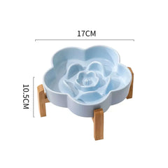 Blue flower-shaped ceramic slow feeder bowl for cats and dogs by Petroom, 17cm wide.