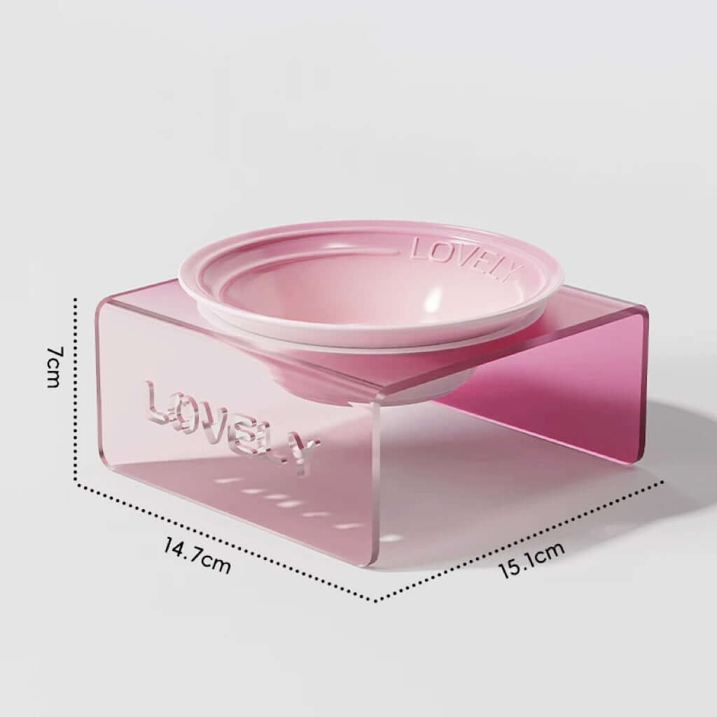 Pink pet bowl with measurements on a light gray background
