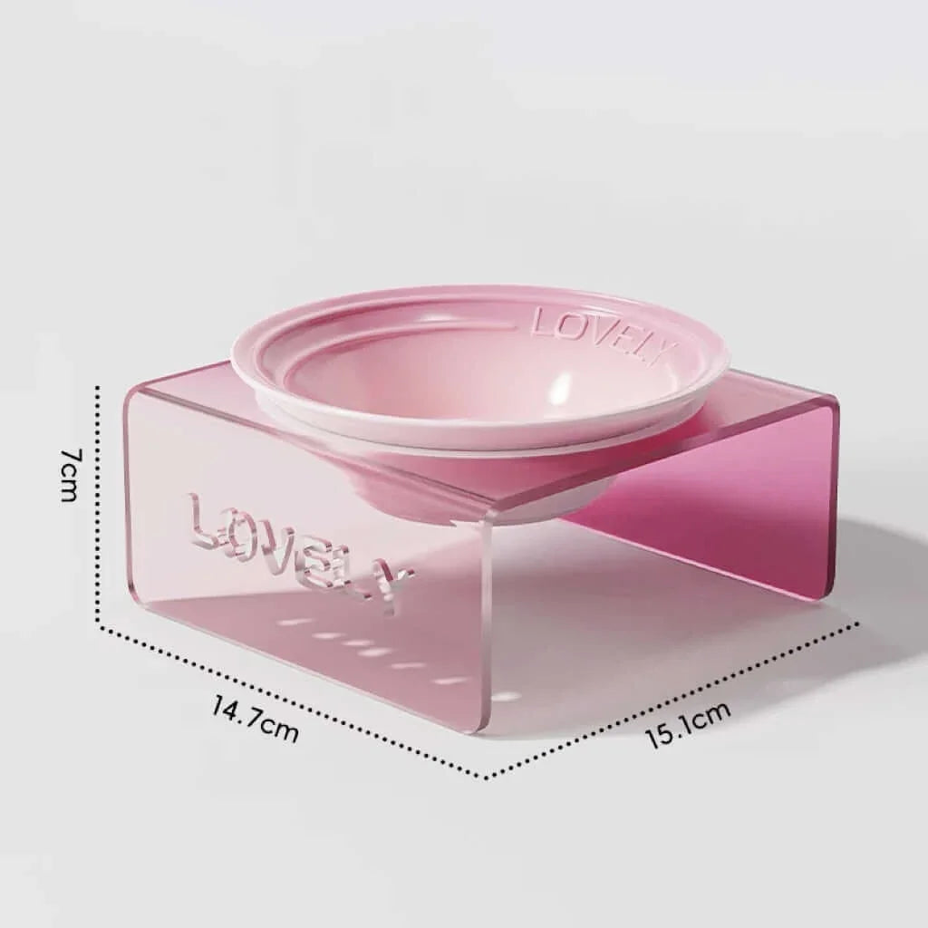 Pink pet bowl with measurements on a light gray background