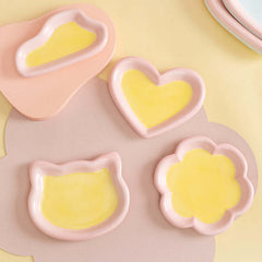 Cute pastel pet bowls in heart, cat, and flower shapes for cats and dogs