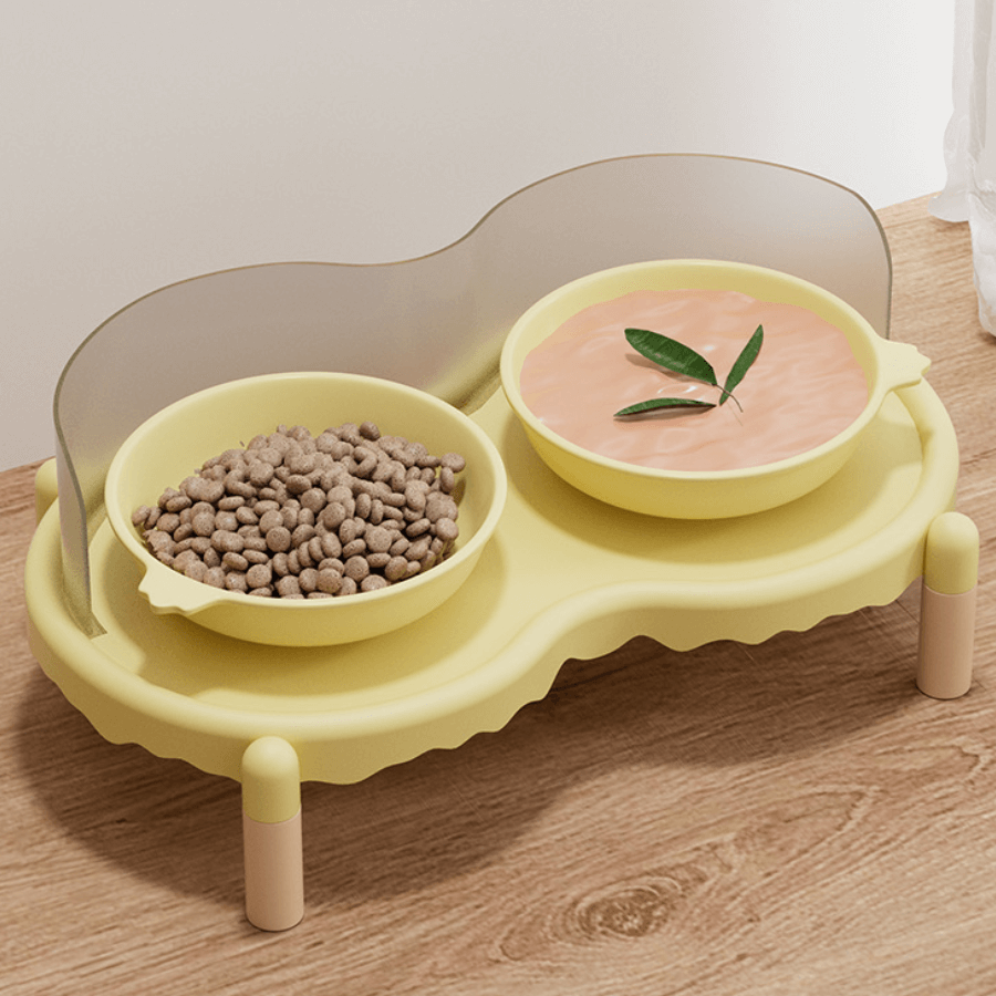 Yellow elevated pet feeder with two bowls: dry kibble and wet food, on wooden floor