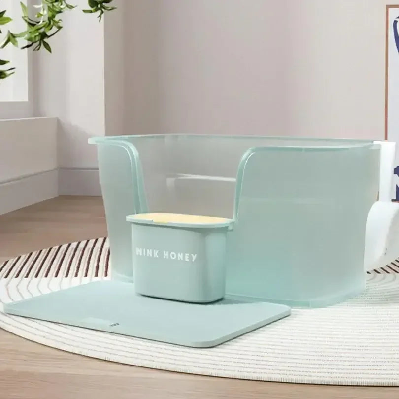 Mint green cat litter box with Wink Honey scoop, stylish pet supplies for modern homes
