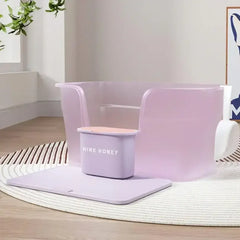 Pastel purple cat litter box with Wink Honey scoop, stylish pet supply for modern homes