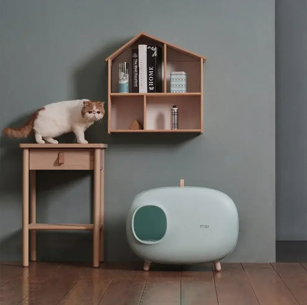 Stylish modern cat litter box with enclosed design, perfect for indoor cats and home decor