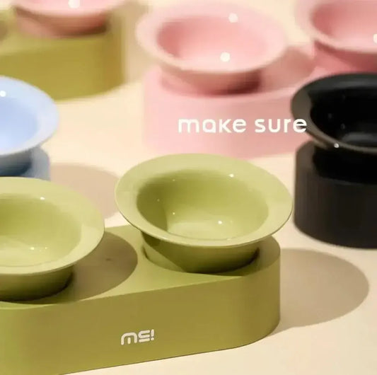 Modern elevated pet bowls in pastel green, pink, blue, and black for cats and dogs, stylish and practical feeding setup