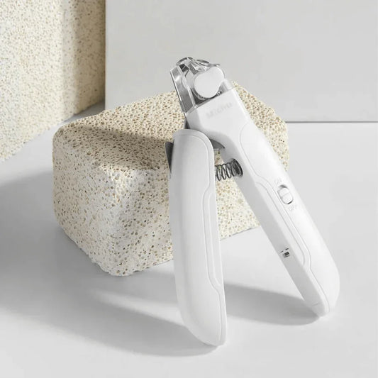 Michu LED light nail clipper for pets Hygiene 2.0 Version on a textured surface.