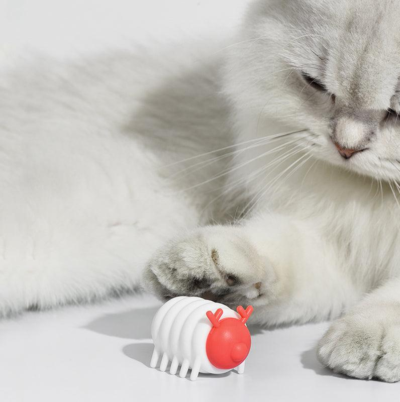 Michu MeowMate Little Monster Automatic Cat Toy with red and white design next to a cat paw.