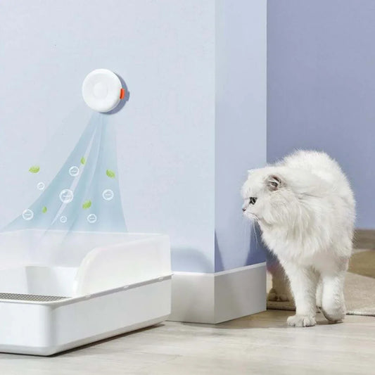 Michu Negative Ion Smart Deodorizer | Cat Litter Box Odour Eliminator with a cat near the litter box.