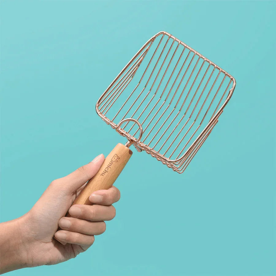 Stainless Steel Cat Litter Scoop Michu - 2 Styles held in hand, showcasing elegant rose gold design.
