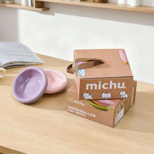 Michu Wide and Shallow Ceramic Pet Bowl packaging with two colorful bowls on a table.