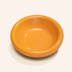 Michu Wide and Shallow Ceramic Pet Bowl in vibrant orange color, designed for preventing whisker fatigue in cats.