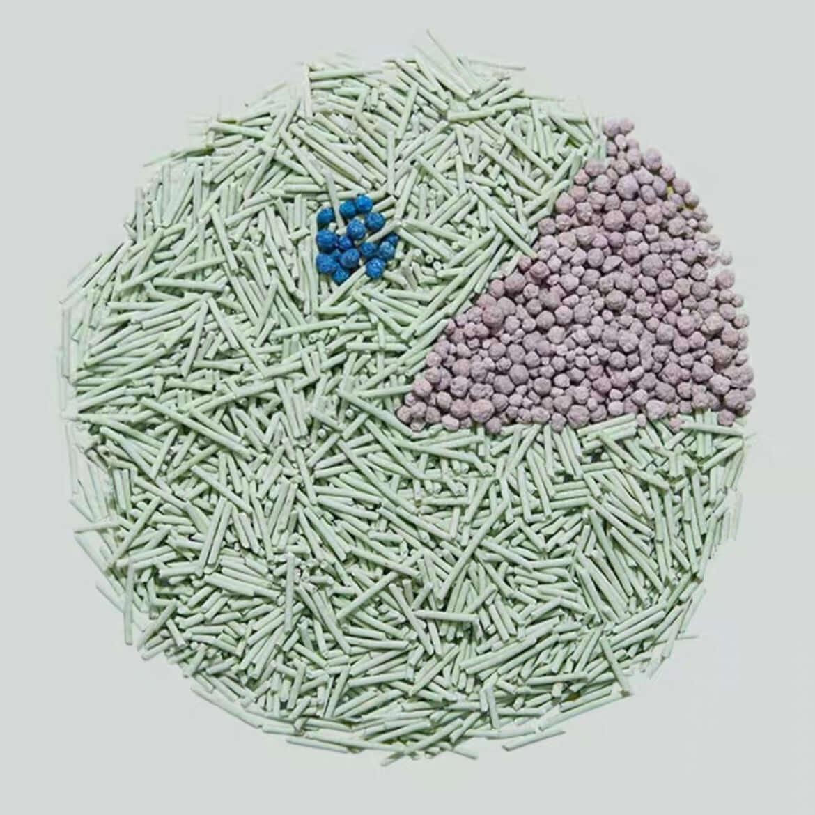 Cat litter mix: green pellets, blue crystals, and purple granules for odor control and absorption