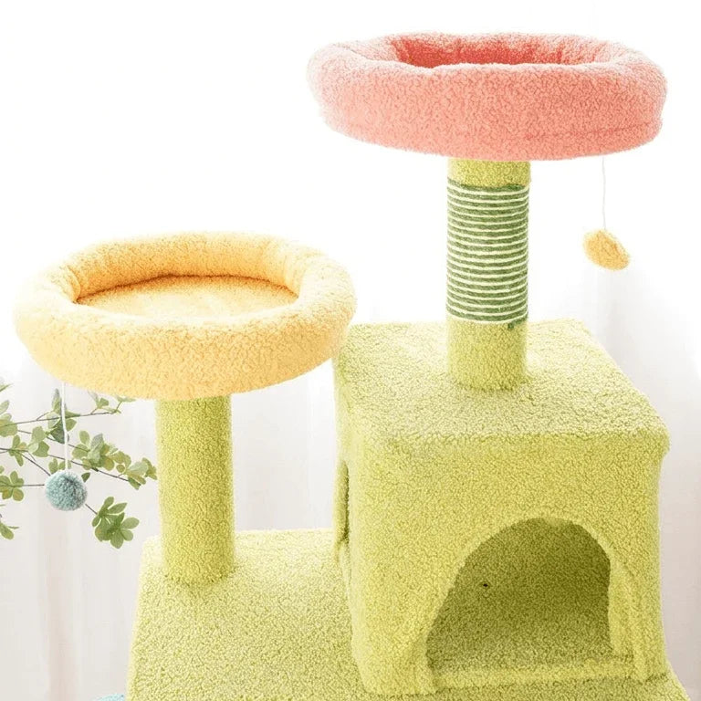 Multi-level Petroom aesthetic cat tower with yellow and pink plush perches and sisal posts.