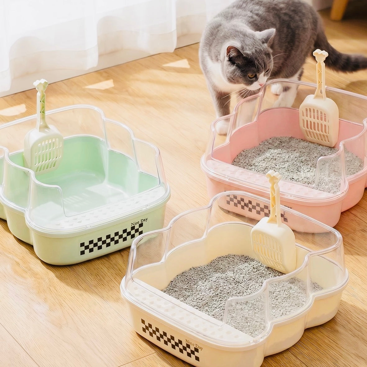Transparent Semi-Enclosed Large Cat Litter Tray with Scoop in multiple colors, featuring a cat and scoops for easy cleaning.