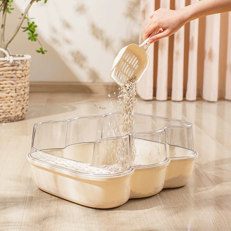 Transparent Semi-Enclosed Large Cat Litter Tray with Scoop being filled with litter for a clean cat environment.