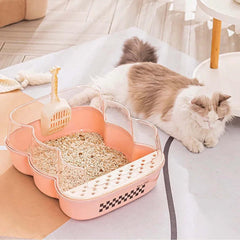 Transparent Semi-Enclosed Large Cat Litter Tray with Scoop alongside a relaxed cat in a bright living space.