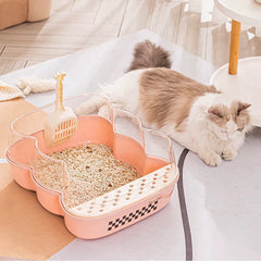 Transparent Semi-Enclosed Large Cat Litter Tray with Scoop alongside a relaxed cat in a bright living space.