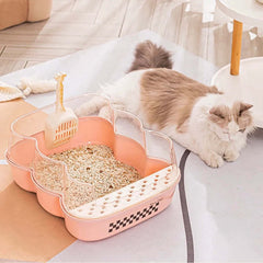Transparent Semi-Enclosed Large Cat Litter Tray with Scoop alongside a relaxed cat in a bright living space.