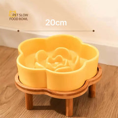 Yellow Petroom flower-shaped ceramic slow feeder bowl on a wooden stand