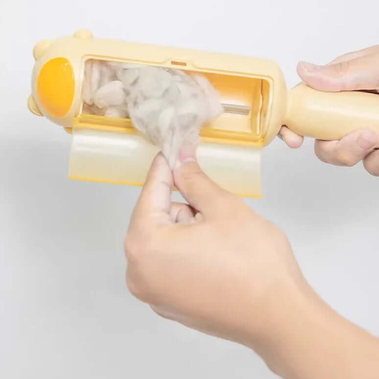 Person using a pet hair removal tool with a white background