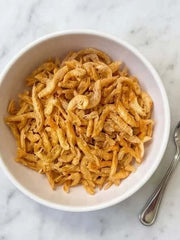 PawDry Freeze-Dried Antarctic Krill 100g in a white bowl, a nutritious treat for pets with Omega-3 and protein.