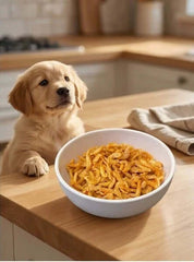 PawDry Freeze-Dried Antarctic Krill 100g in a bowl with a puppy excitedly looking at it on a kitchen counter.