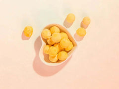 PawDry Freeze-Dried Quail Egg Yolk 100g in heart-shaped bowl, nutrient-dense cat treats.
