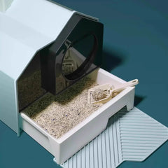Modern enclosed cat litter box with scoop and litter, ideal for indoor cats and clean pet care