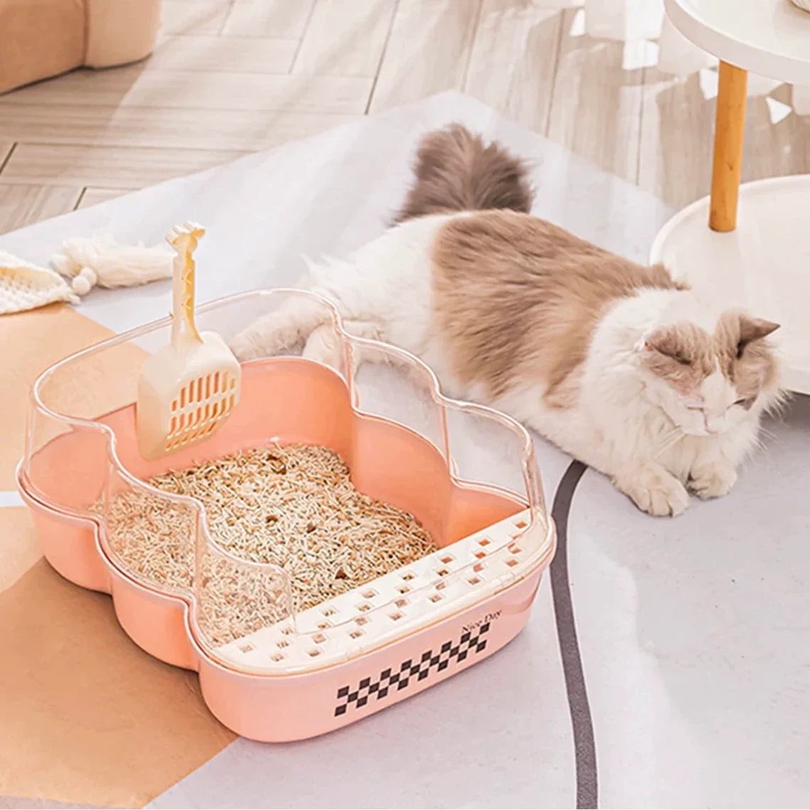 Transparent Semi-Enclosed Large Cat Litter Tray with Scoop alongside a relaxed cat in a bright living space.