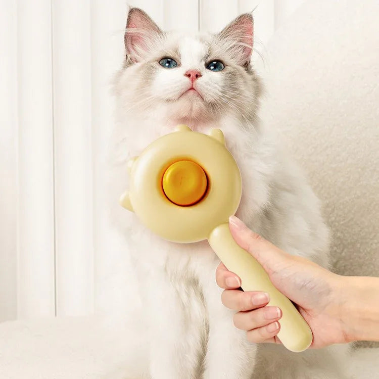 AIWO Self-Cleaning Slicker Lovely-Cat Style grooming brush being used on a fluffy white cat.