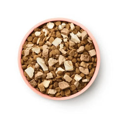 Animals Like Us Freeze Dried Raw Mix 50 Ocean Fish with Chicken Cat Food 1.36 kg in a pink bowl.