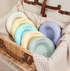 Michu Ceramic Cat Bagel Bowl – Anti-Whisker Wide Shallow Pet Food Bowl Rainbow Colours displayed in a wicker basket.
