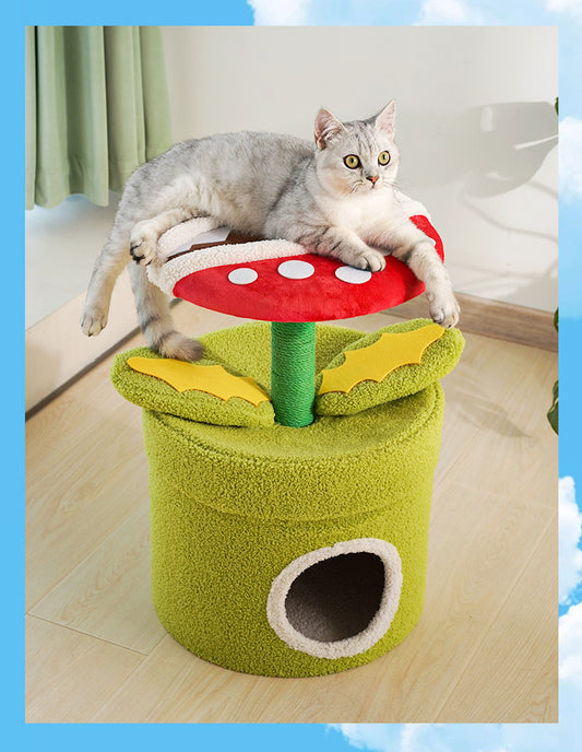Gray cat resting on the "Man-Eating Flower" Cat Tree with vibrant mushroom design and green base.