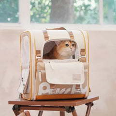 Cream and tan cat carrier backpack with orange tabby cat inside, ideal for stylish pet travel